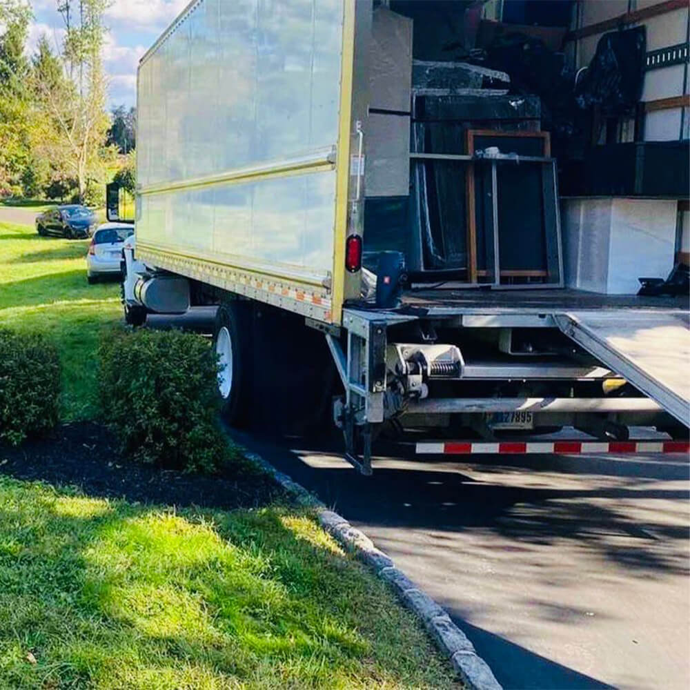 CarePhilly Movers team moving protected furniture